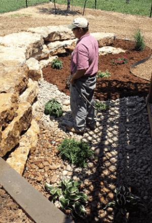 George Snouffer cleaning stone landscaping